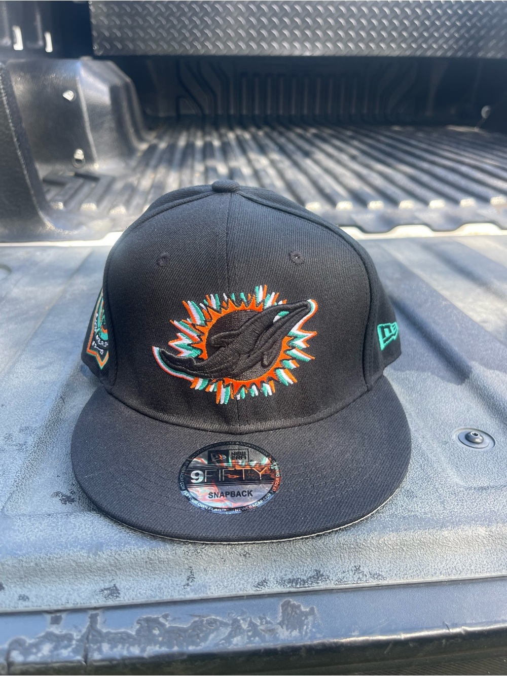 New Era Black Miami Dolphins Logo Snapback Hat with Teal and Orange Accents